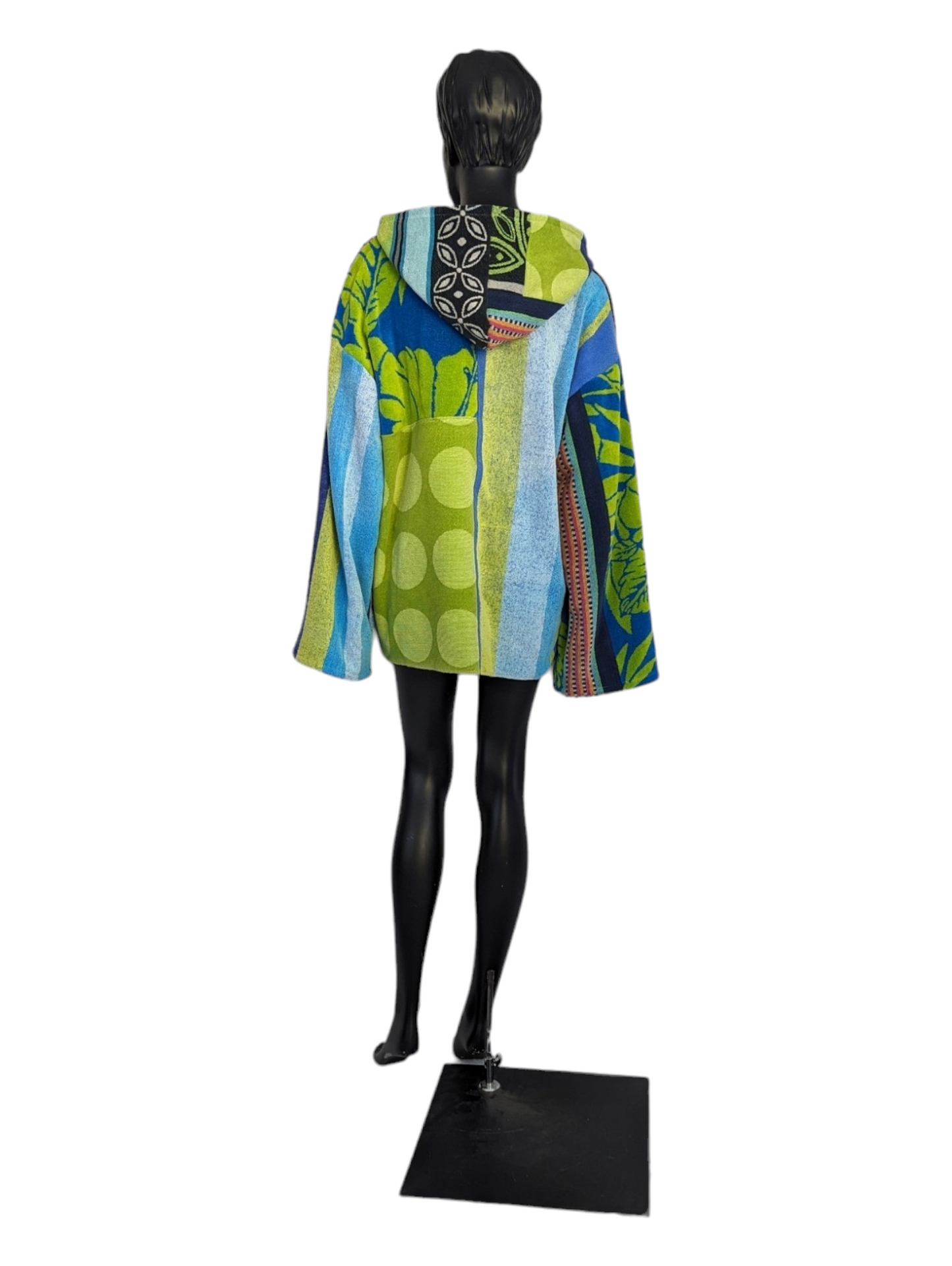 Rear view of mannequin wearing men's patchwork hoodie.