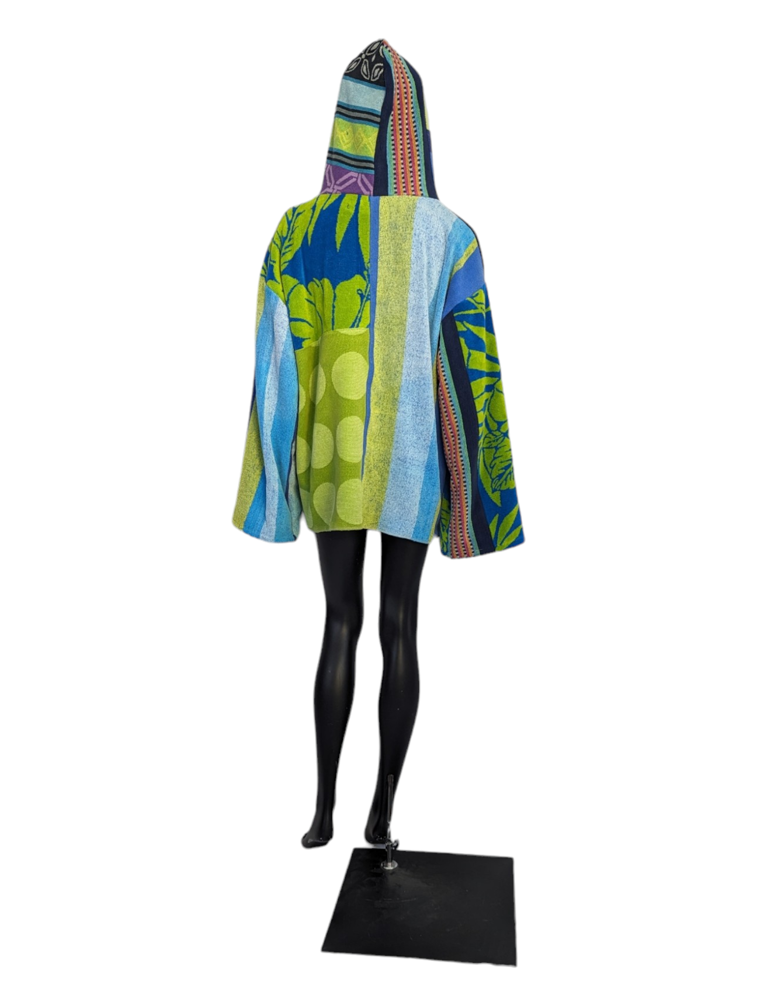 Rear view of woman wearing patchwork hoodie.