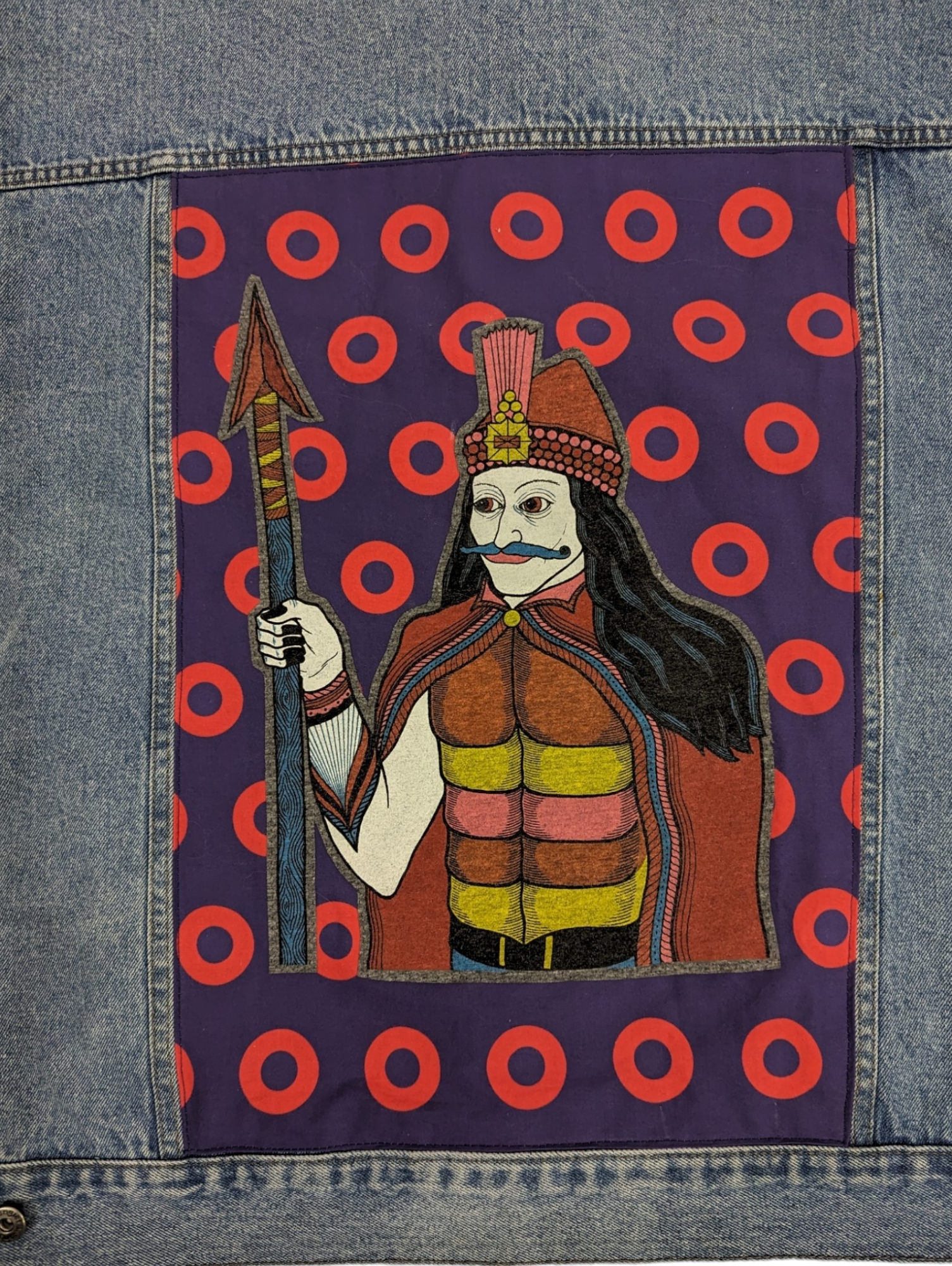 Close up view of Vlad the impaler on phish doughnut fabric.