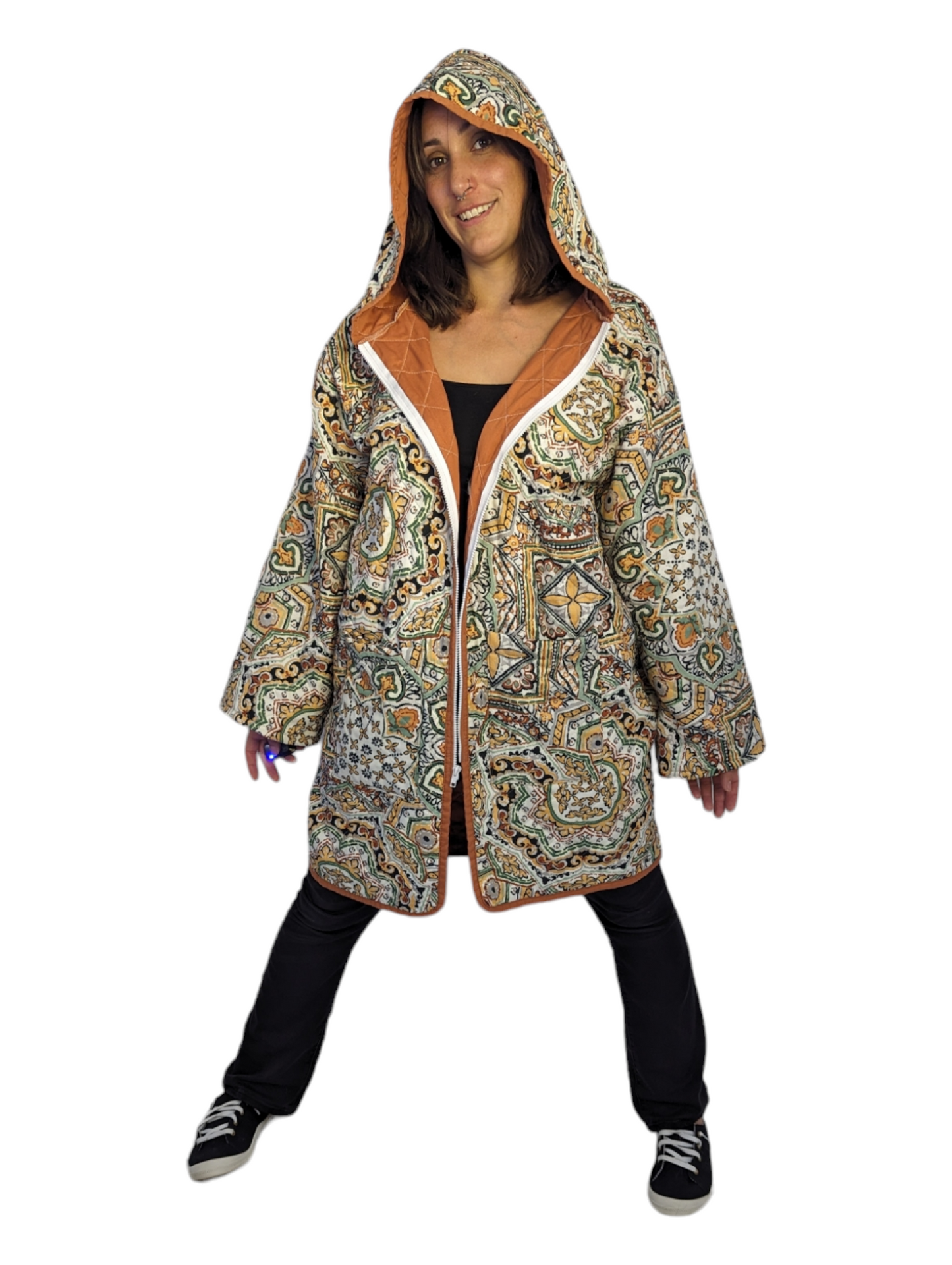 Front view of woman wearing psychedelic orange paisley blanket coat.