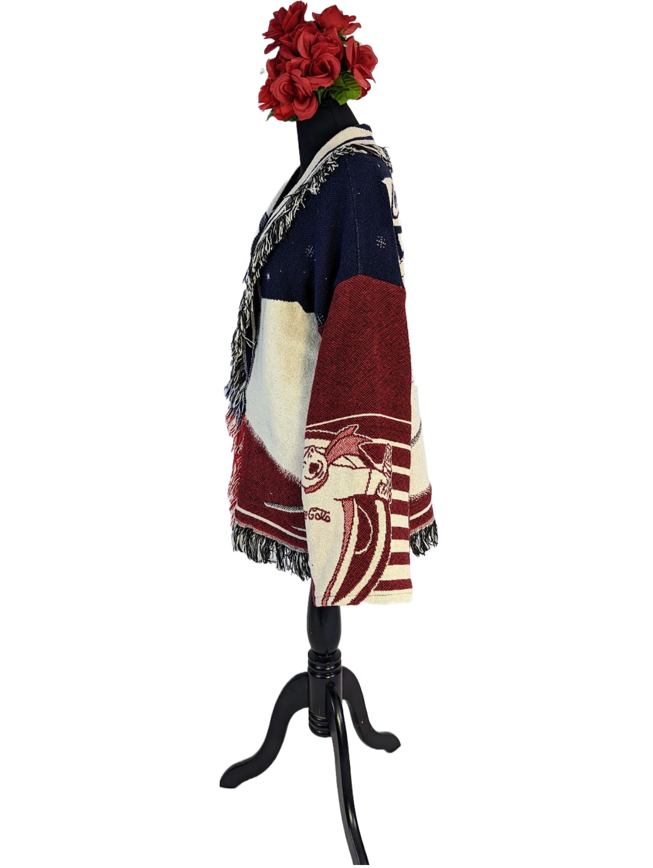 Side view of blue, white and red blanket coat displayed on dress-form.