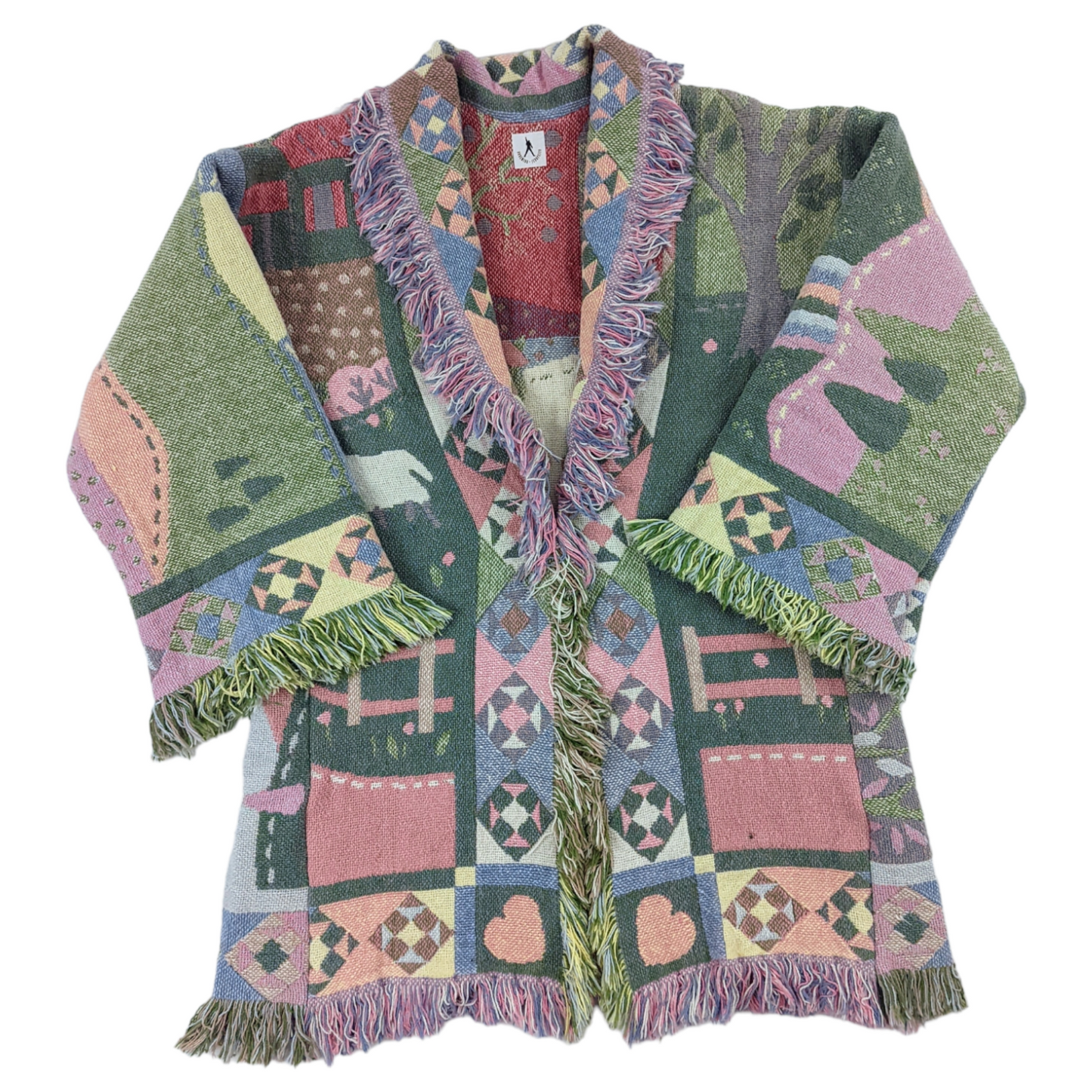Flat lay of patchwork style quilt coat made from tapestry blanket in pastel shades.