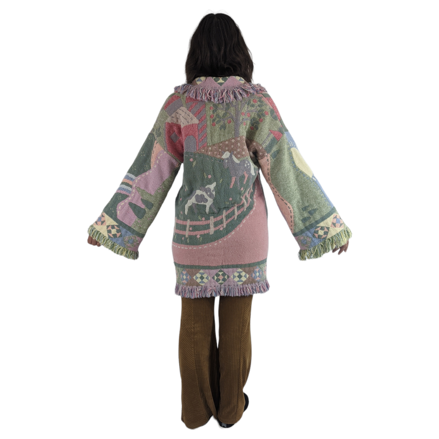Back view of woman wearing blanket coat that is perfect gift for cow lovers.