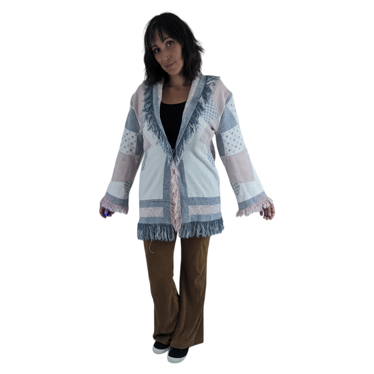 front view of woman wearing woven tapestry blanket coat.