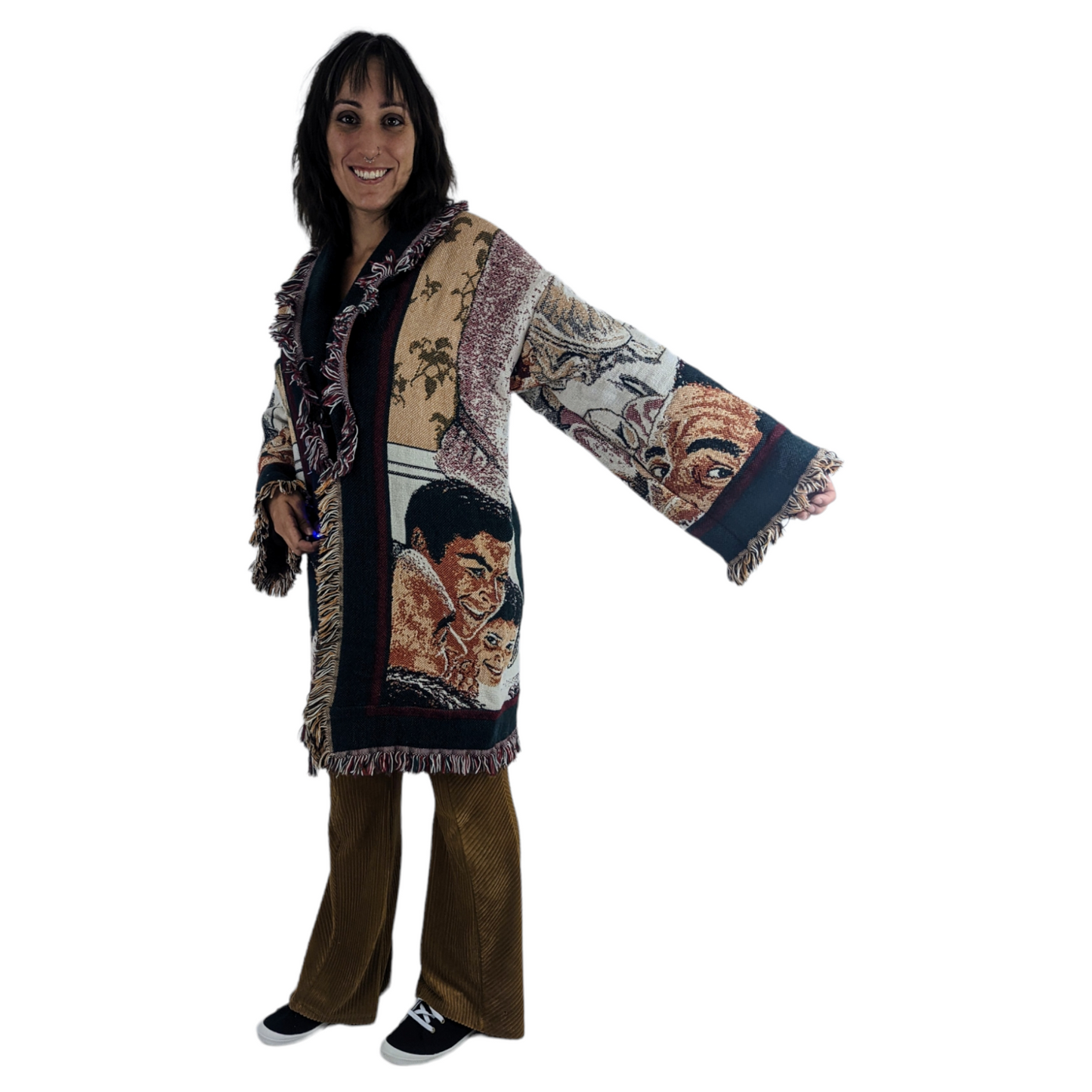 Front view of woman wearing fall blanket coat with Norman Rockwell painting.