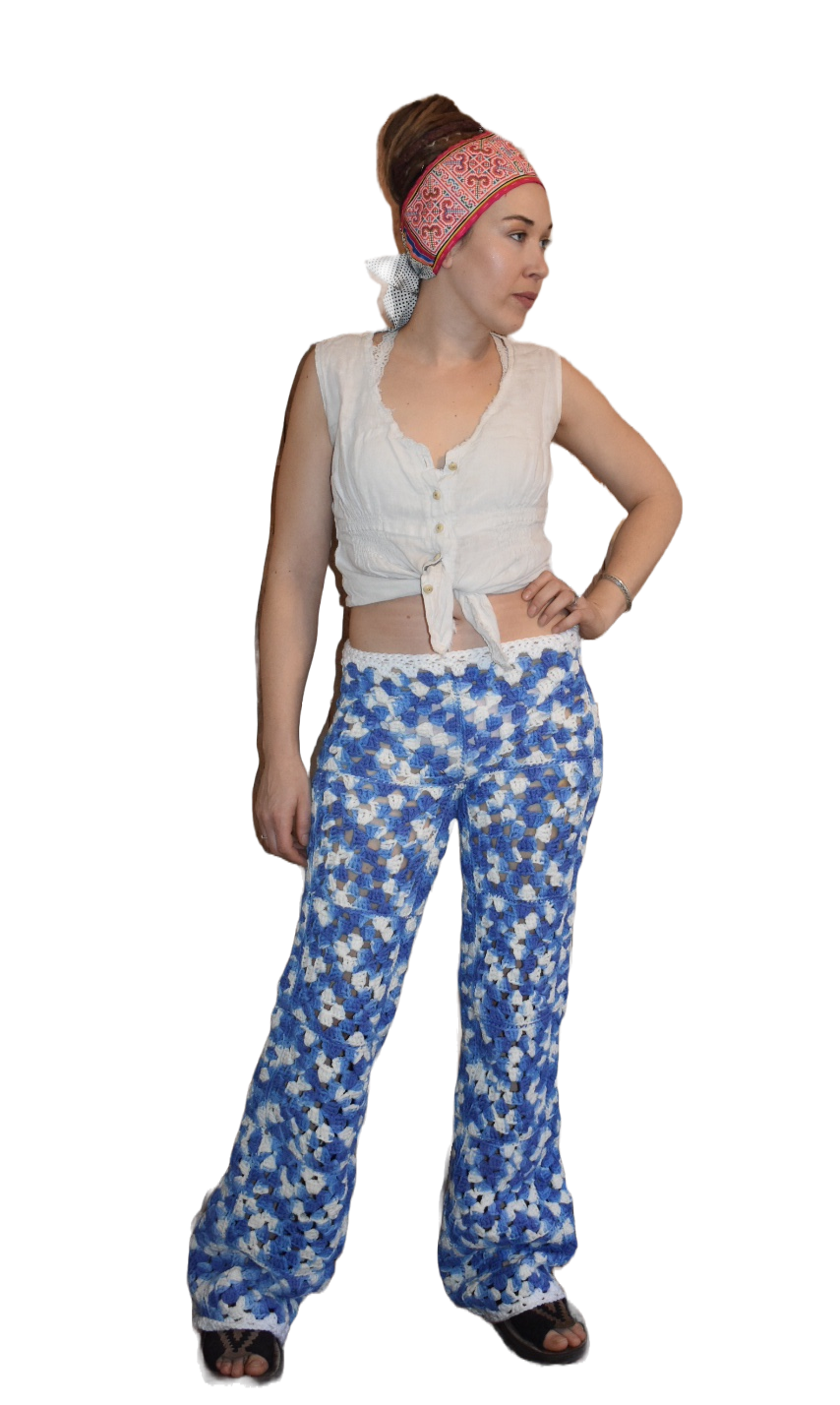 Front view of woman wearing wide leg pants made from upcycled crochet granny squares.